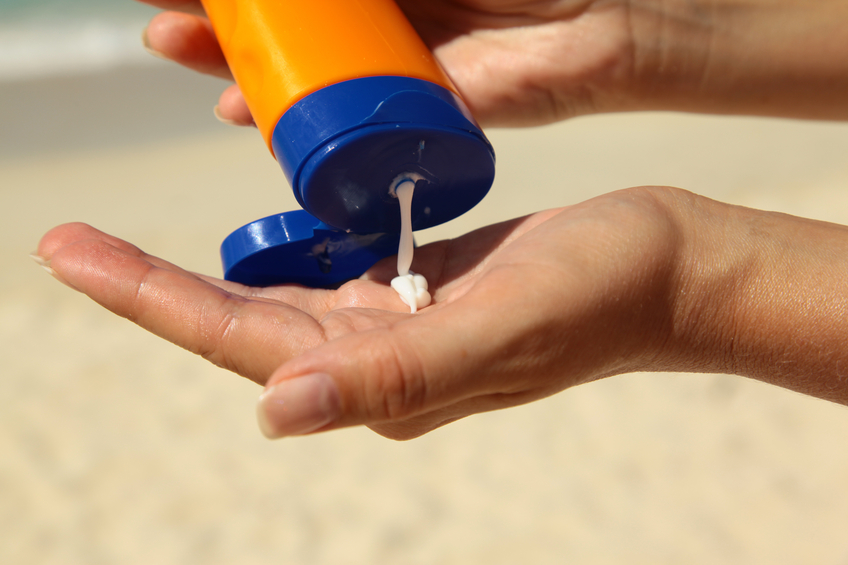 Woman holding sunscream